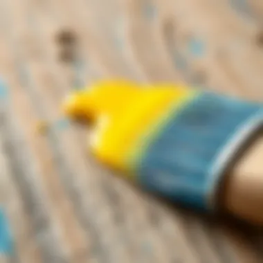 Close-up of acrylic paint application on a wooden surface