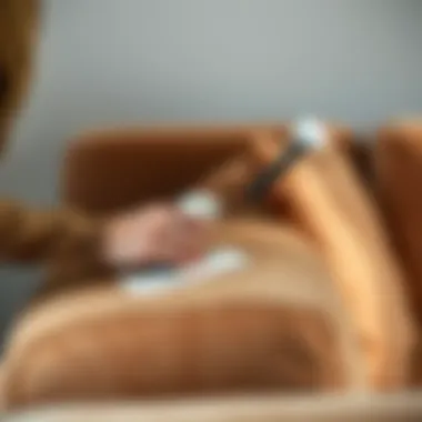 Proper Application of Suede Cleaners Person applying a special cleaner to a suede sofa