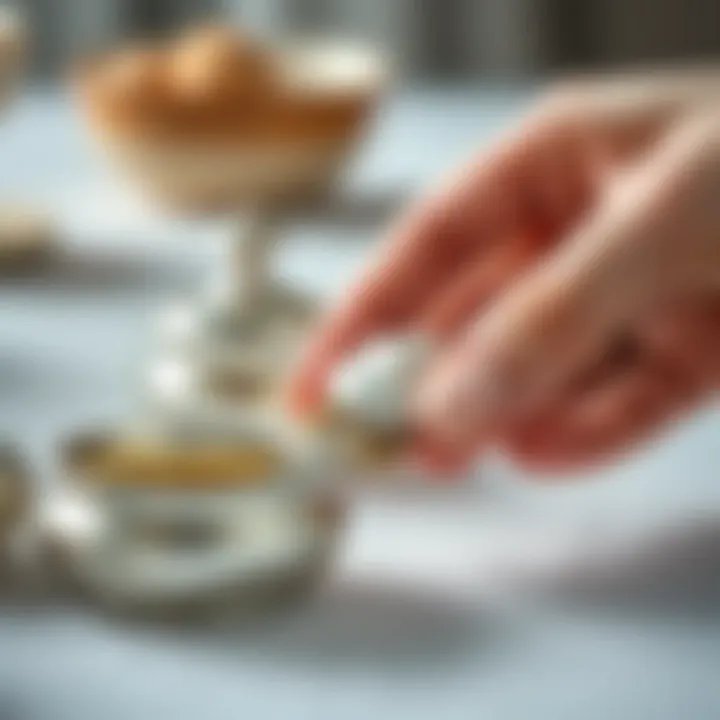 Hand applying polish to silver items gently