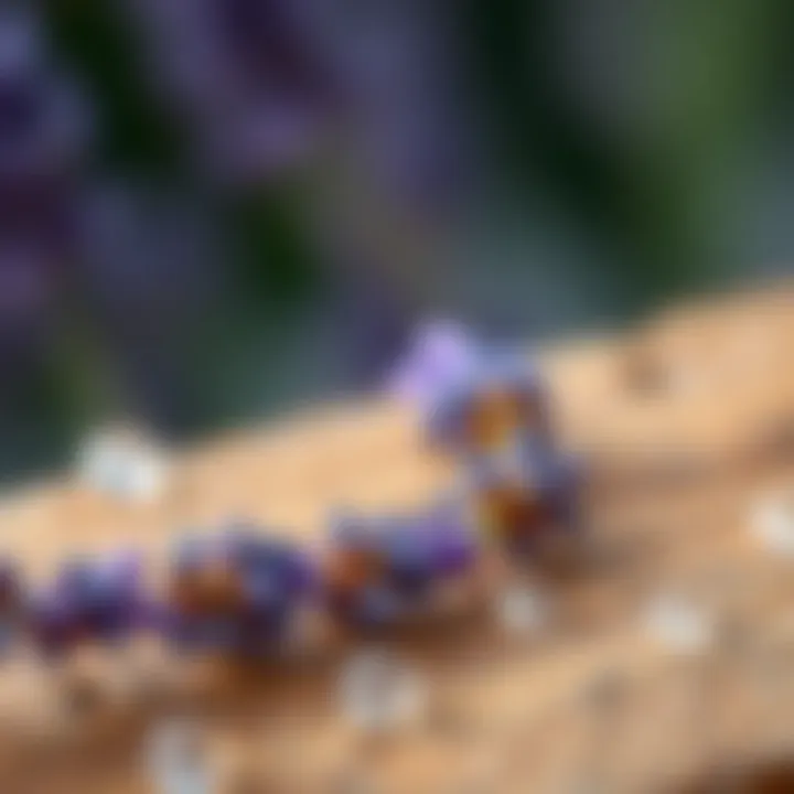 A close-up of lavender oil droplets on a wooden surface