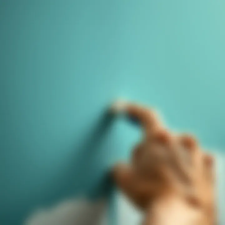 A close-up of a skilled hand applying paint to a surface